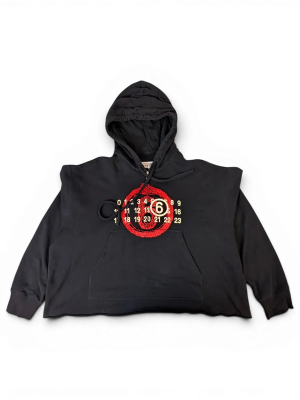 JAKE & IPI black MM6 Lunar New Year hoodie with a red circular graphic and numeric logo on the front