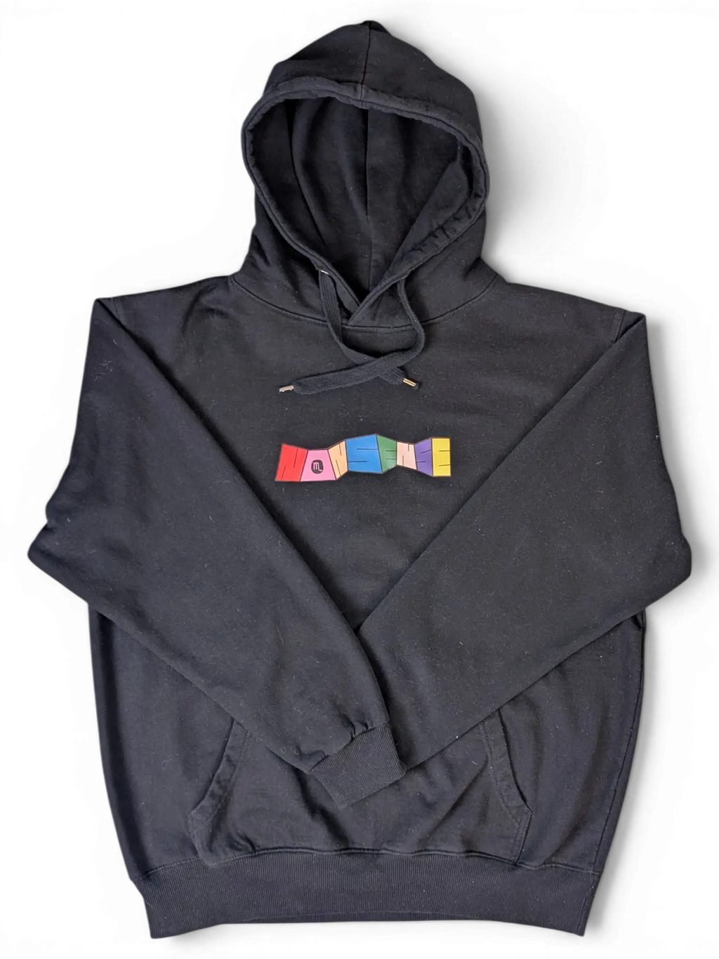 JAKE & IPI black hoodie featuring a colourful Nonsense graphic on the chest with a drawstring hood and front pocket.