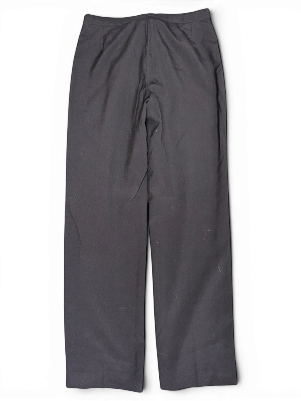 JAKE & IPI black tailored suit trousers with a clean flat front design laid flat on a green surface.