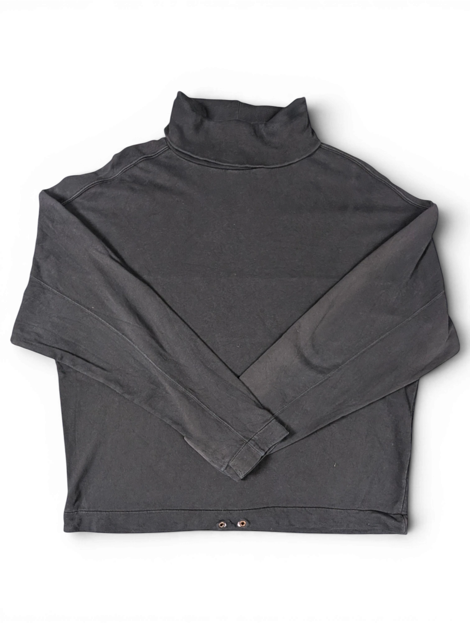 JAKE & IPI black cotton turtleneck sweatshirt with a relaxed fit and metal eyelet detail at the hem.