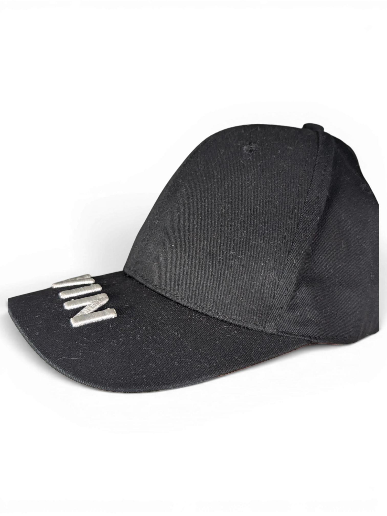 JAKE & IPI black IBE Vain cap with silver metallic lettering on the brim