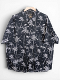 JAKE & IPI Atlas For Men black and white Hawaiian shirt with palm tree and sailboat print on a wooden hanger