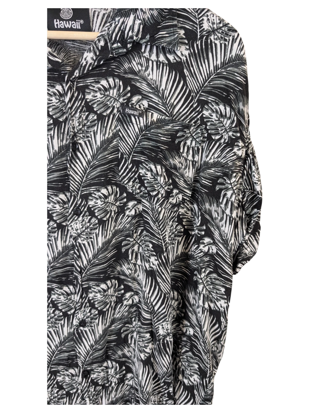 JAKE & IPI black and white Hawaiian shirt featuring a tropical palm leaf print and a button-down collar.