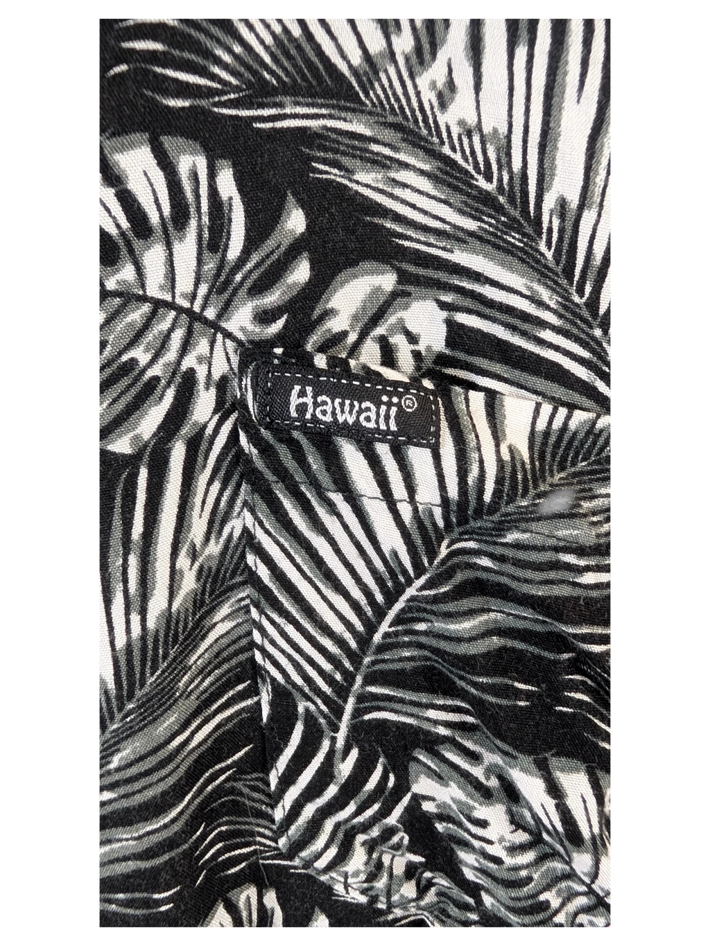 JAKE & IPI black and white Hawaiian shirt featuring a detailed tropical palm leaf print and a Hawaii brand tag.