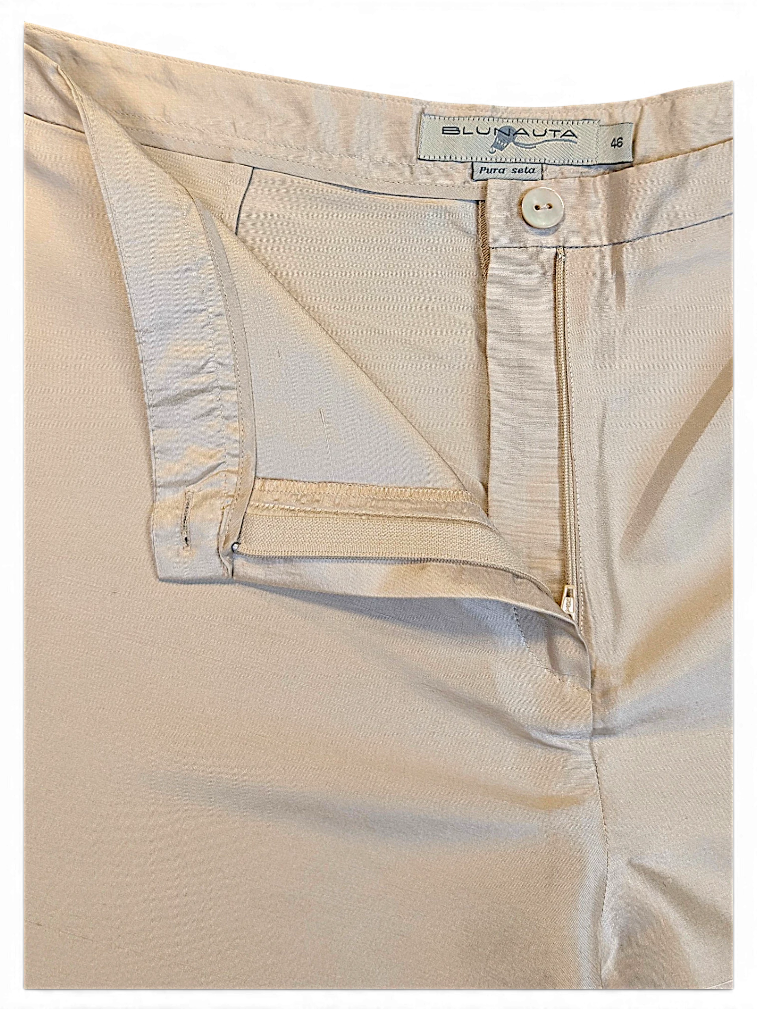 JAKE & IPI Blunauta ivory pure silk trousers featuring a button and zip fly closure and interior brand label.