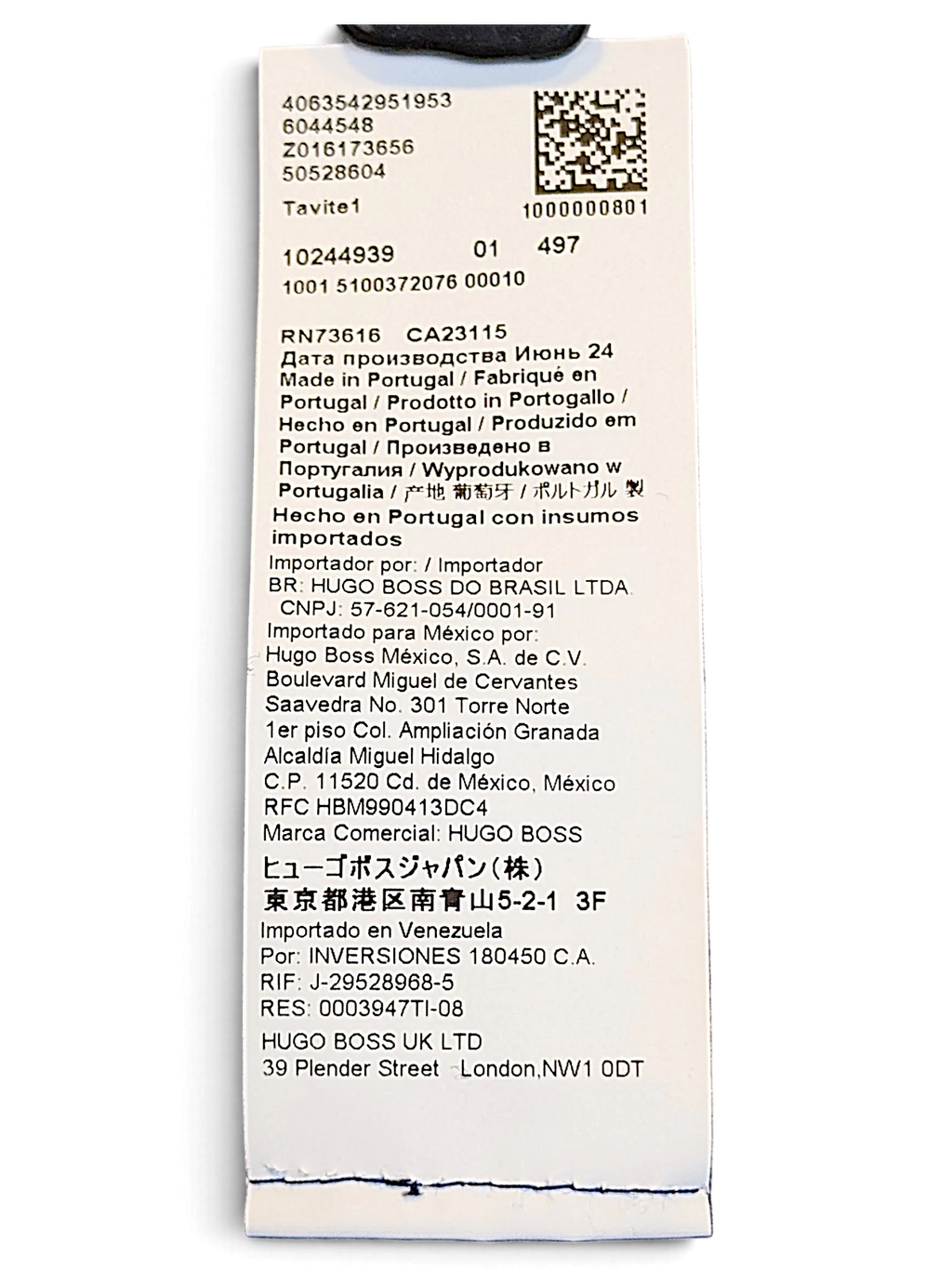 JAKE & IPI BOSS navy velour track pants care label showing manufacturing details and origin in Portugal