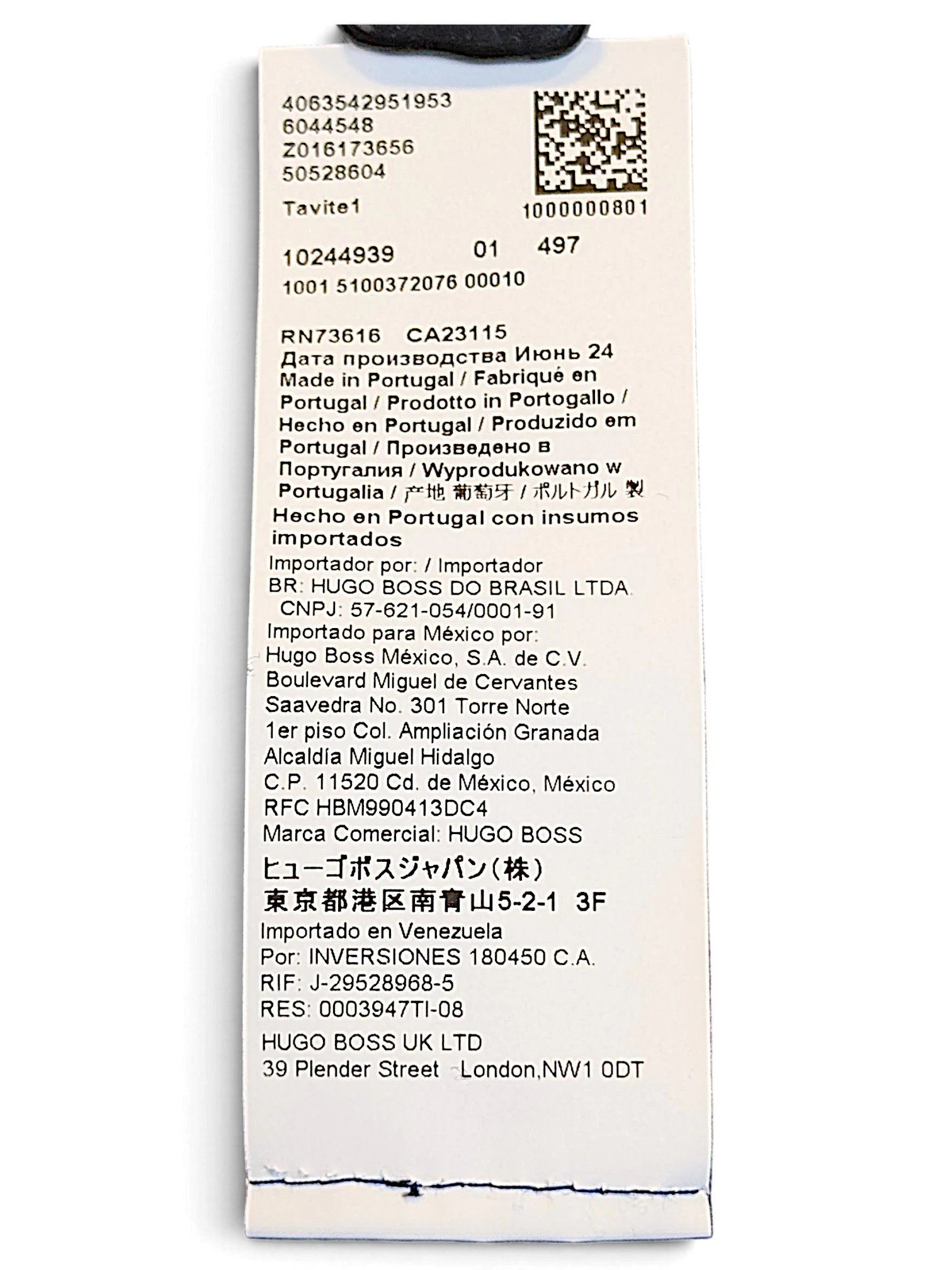 JAKE & IPI BOSS navy velour track pants care label showing manufacturing details and origin in Portugal