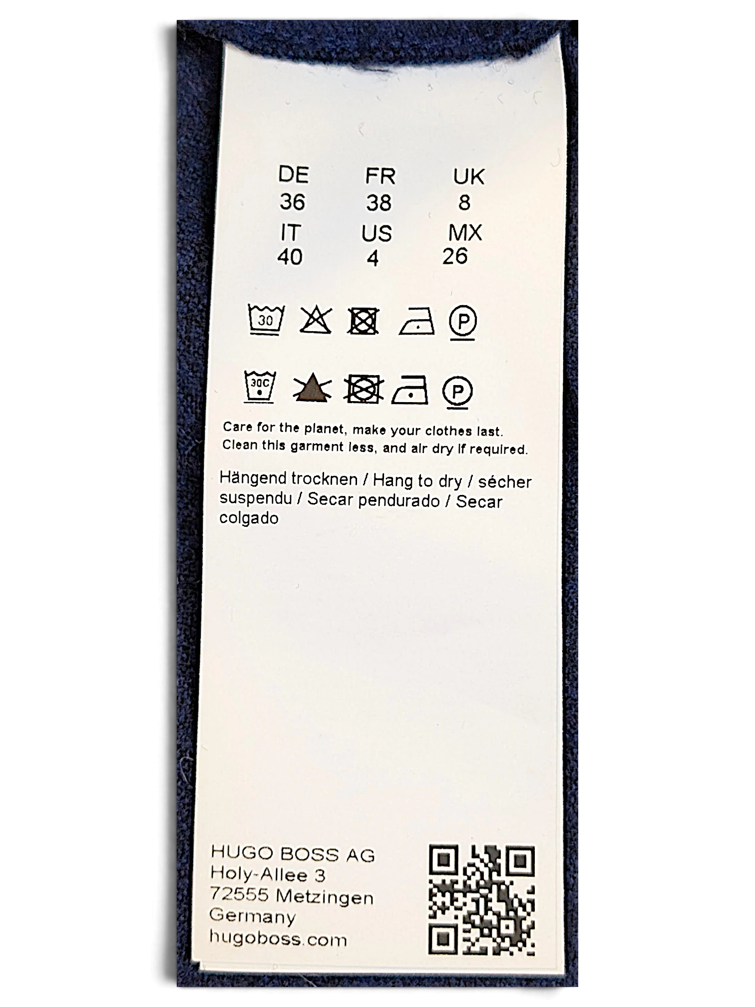 JAKE & IPI BOSS navy velour track pants care label with international sizing and washing instructions