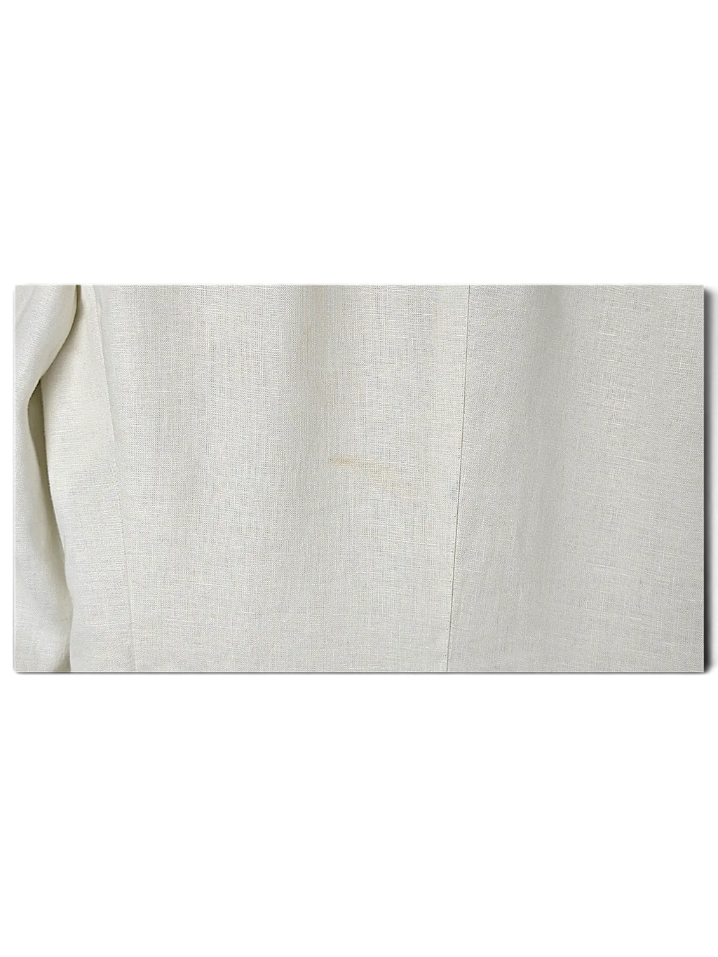 Close-up of the JAKE & IPI Brioni linen suit in off-white, showcasing the natural texture of the premium fabric.