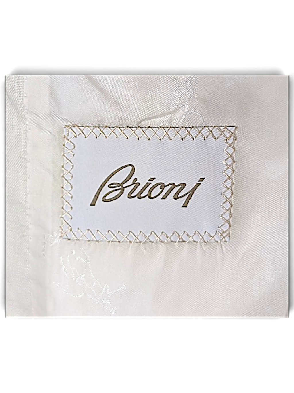 JAKE & IPI Brioni linen suit interior label with white fabric and embroidered logo detail