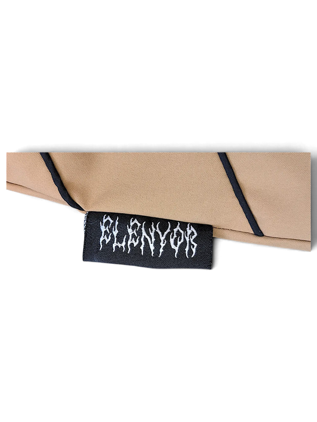 JAKE & IPI brown fabric detail with black piping and a black Elenyor embroidered brand label
