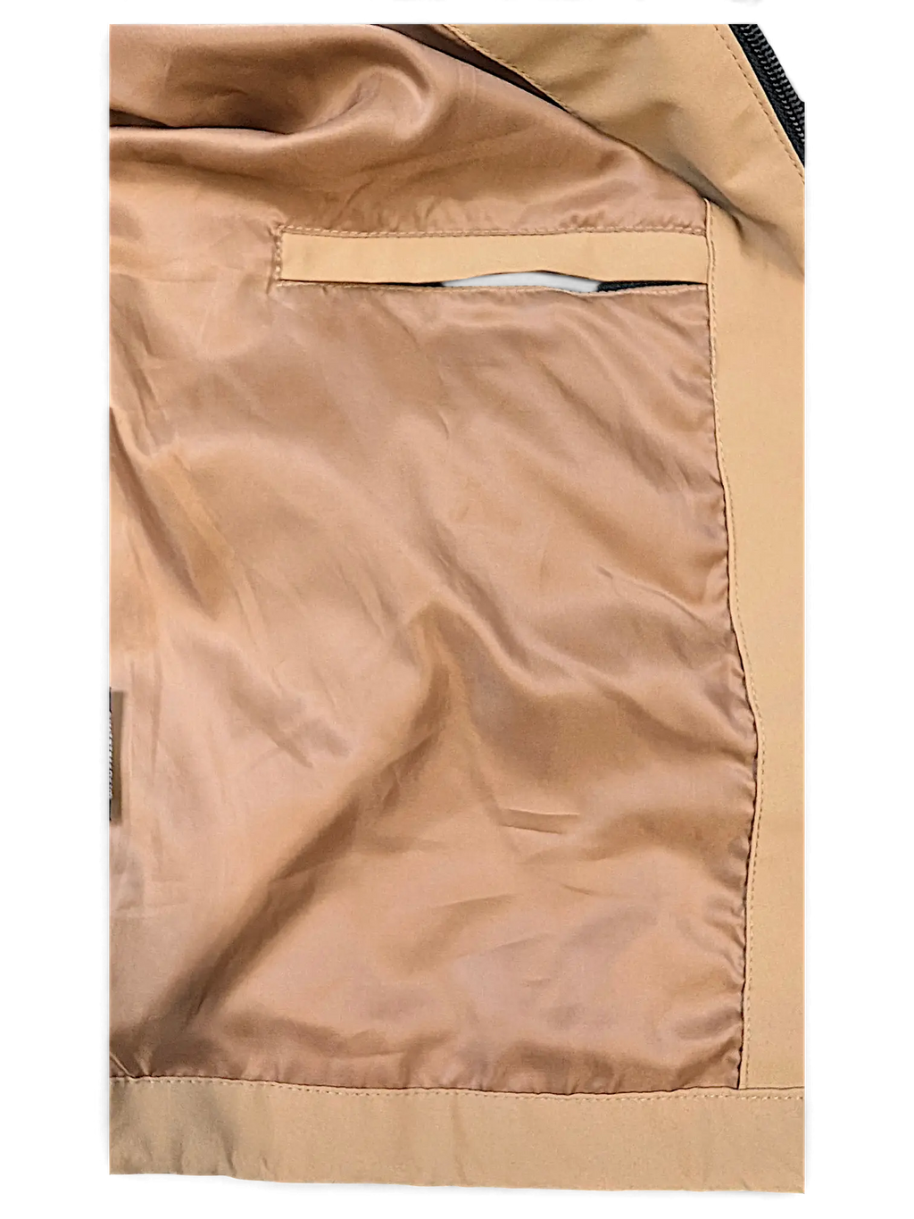 Interior lining and pocket detail of the brown JAKE & IPI Elenyor jacket featuring smooth fabric construction.