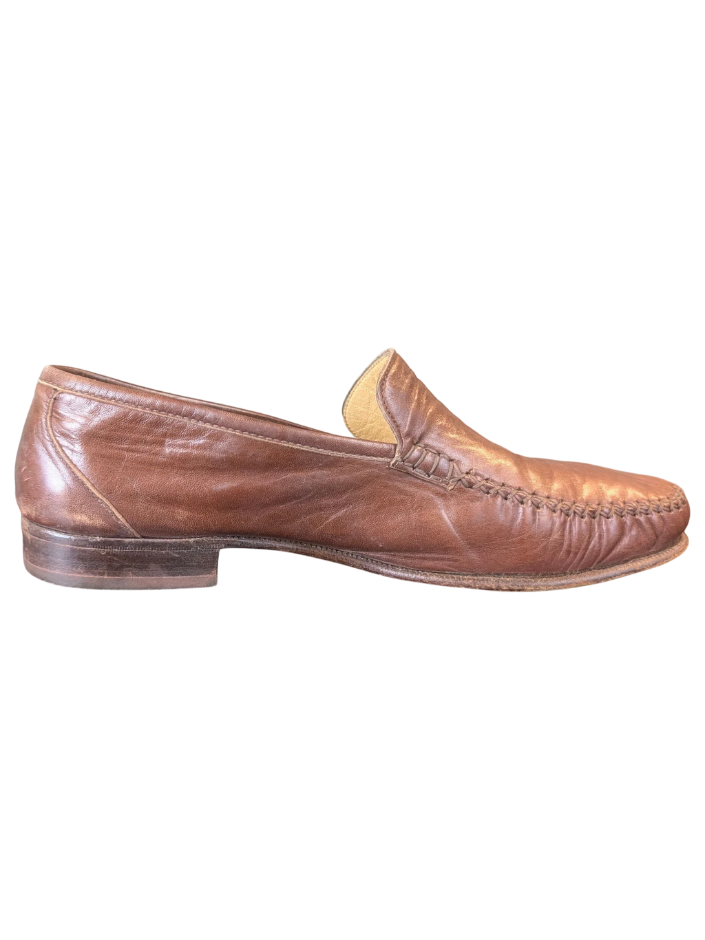 JAKE & IPI brown leather loafers with moccasin-style stitching on a wooden surface
