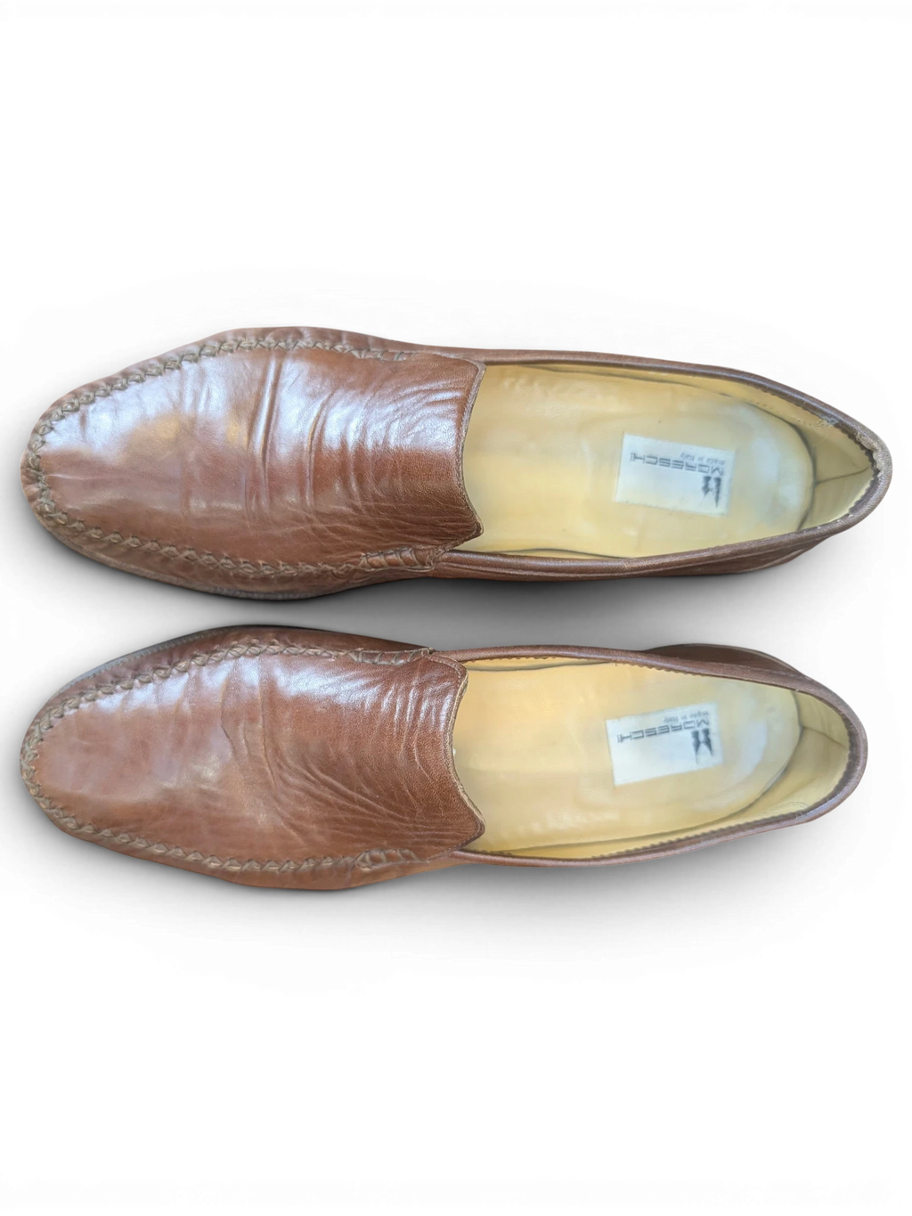 JAKE & IPI brown leather loafers with moccasin-style stitching, top-down view