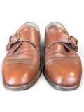 JAKE & IPI Melluso Uomo brown leather monk strap shoes with brass buckles and brogue toe cap detail.