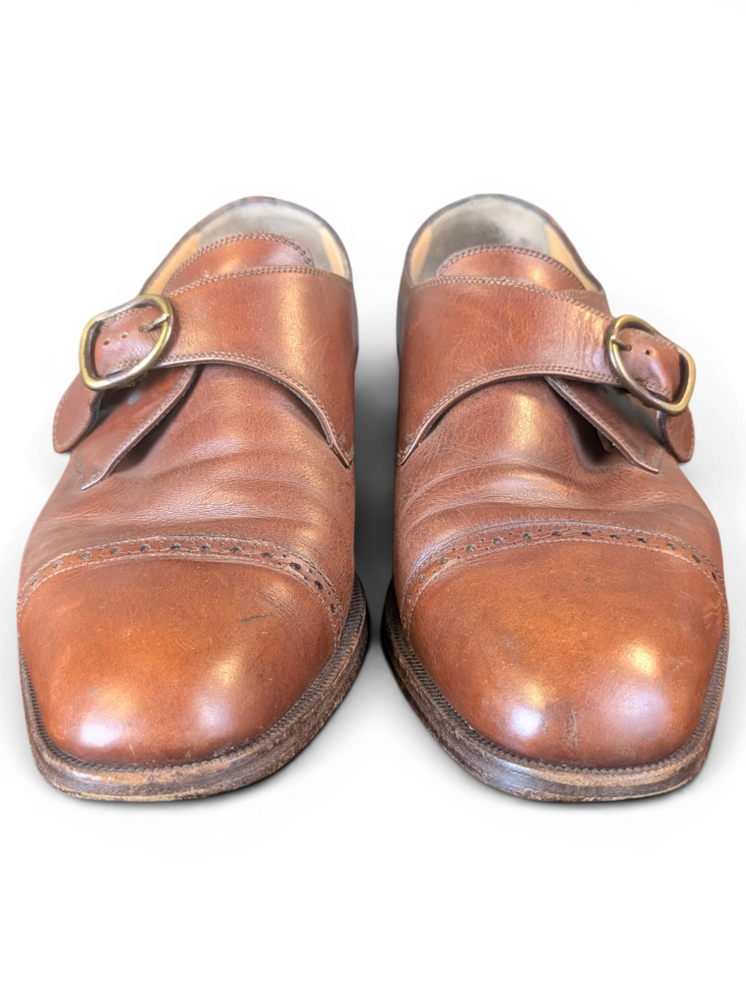 JAKE & IPI Melluso Uomo brown leather monk strap shoes with brass buckles and brogue toe cap detail.