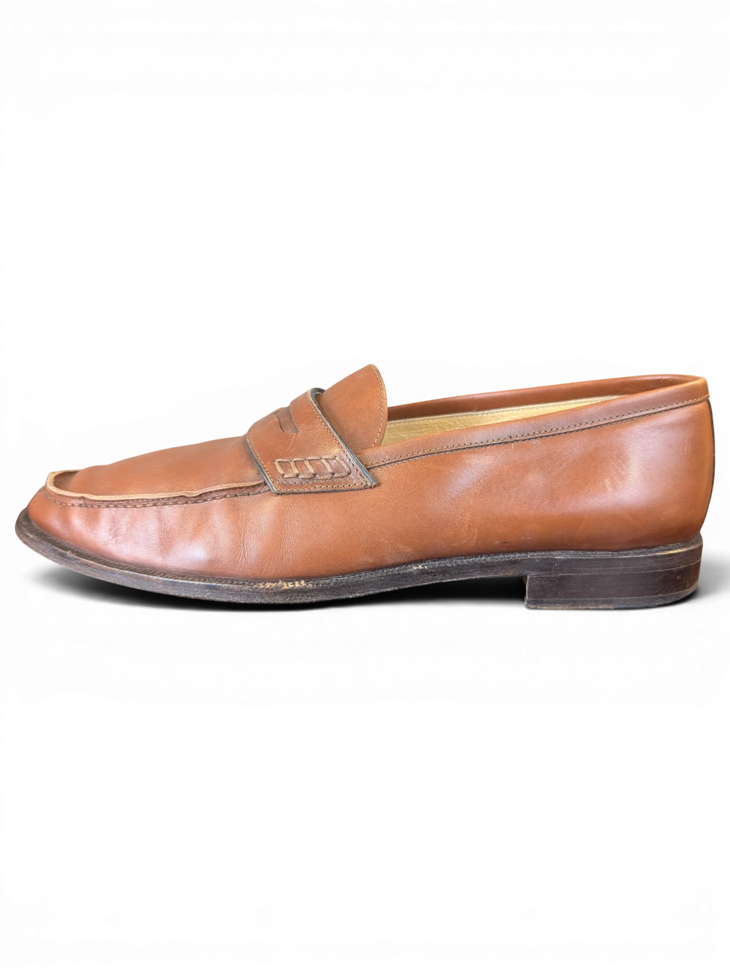 JAKE & IPI brown leather penny loafers with a classic slip-on design and stitched apron toe detail.