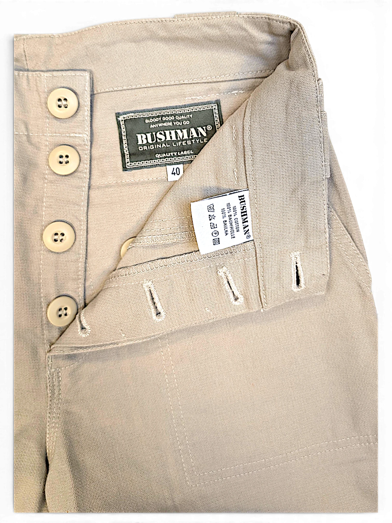 JAKE & IPI Bushman beige utility trousers featuring a button-fly closure and internal brand labels.