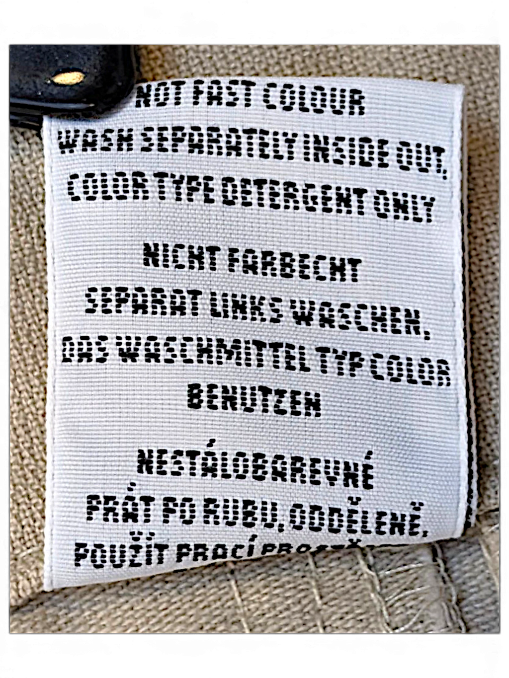 JAKE & IPI Bushman utility trousers care label with washing instructions in multiple languages