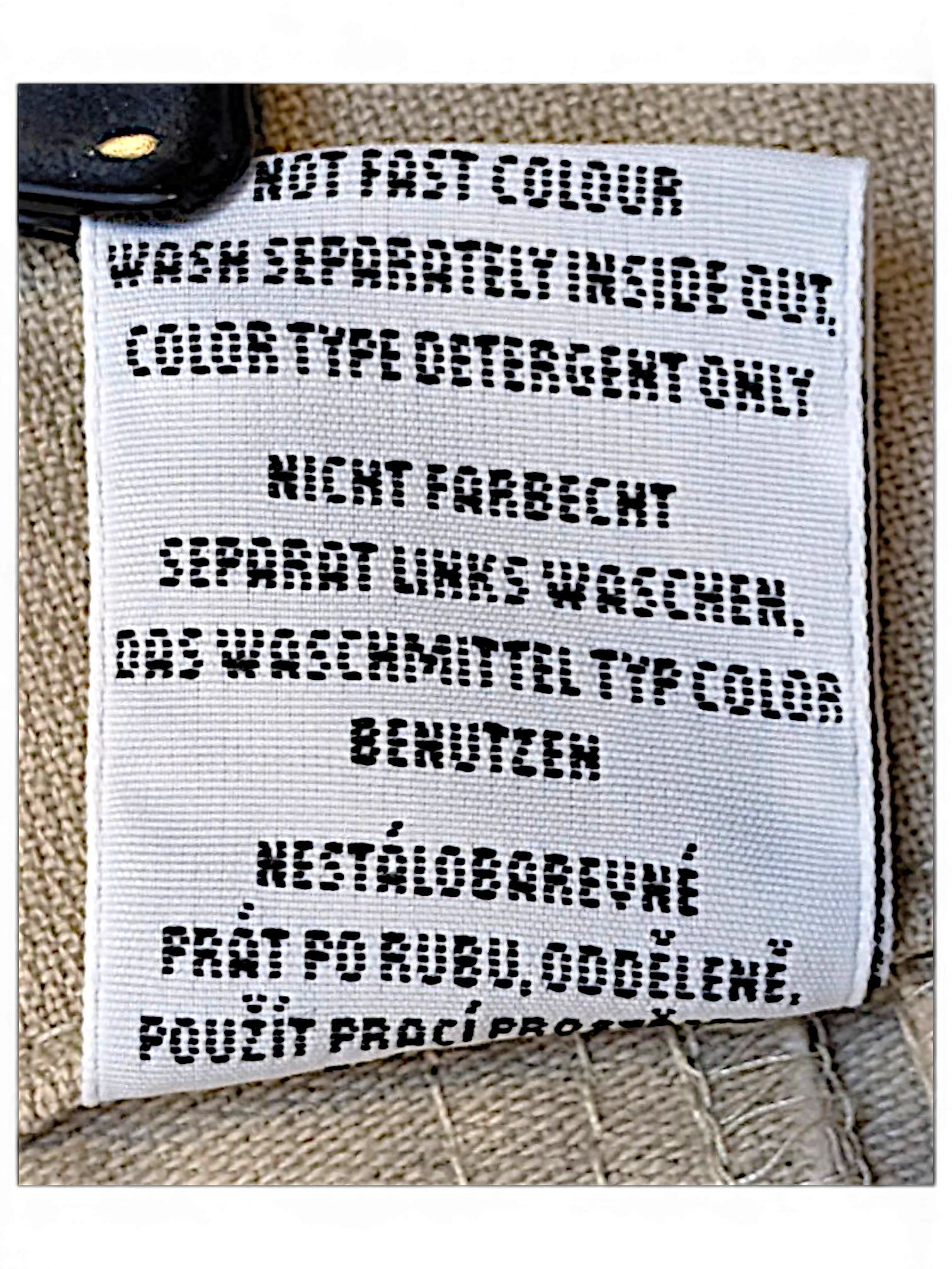 JAKE & IPI Bushman utility trousers care label with washing instructions in multiple languages
