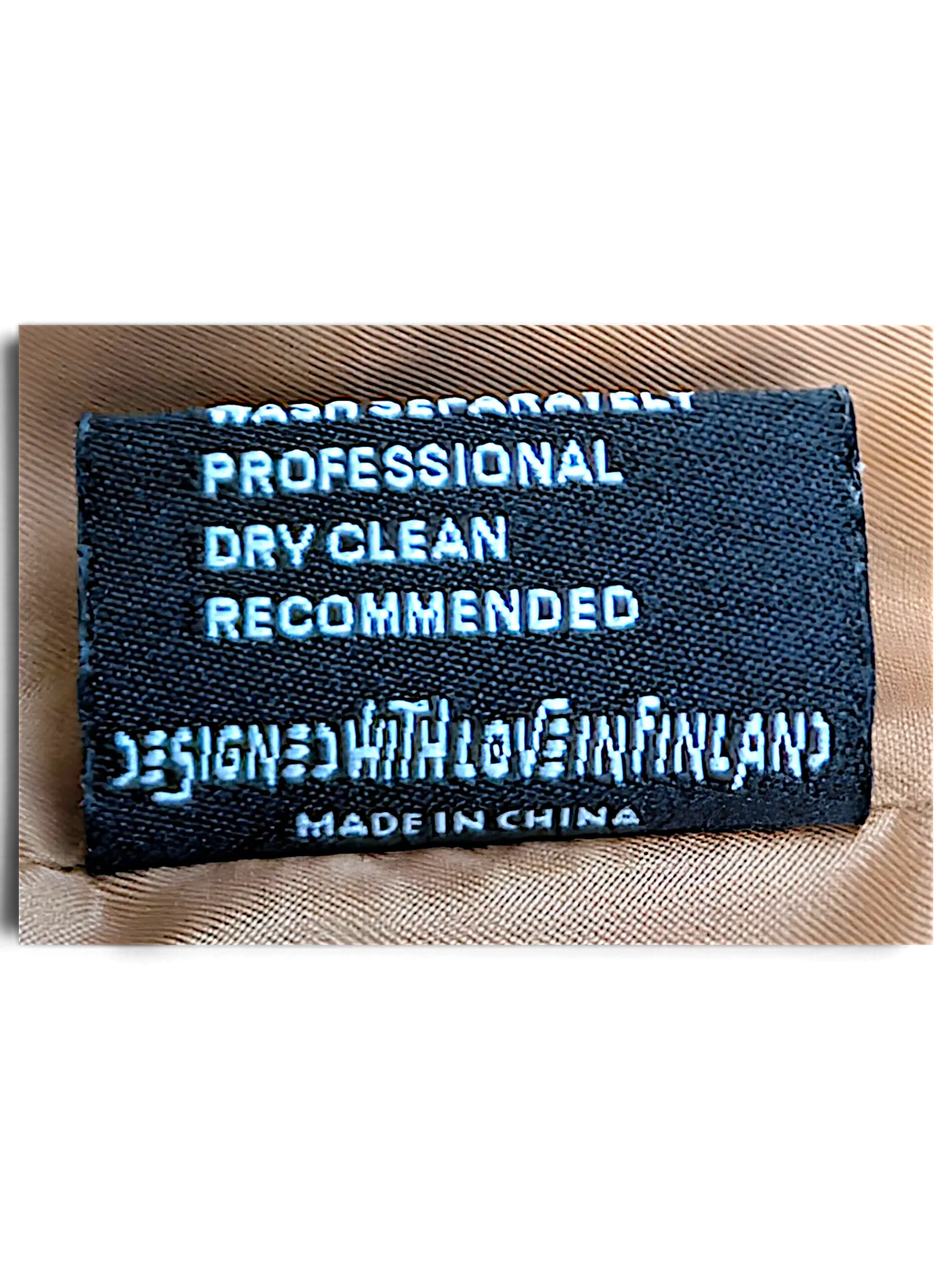 JAKE & IPI IBE Elenyor jacket and pants care label with professional dry clean instructions and origin details.