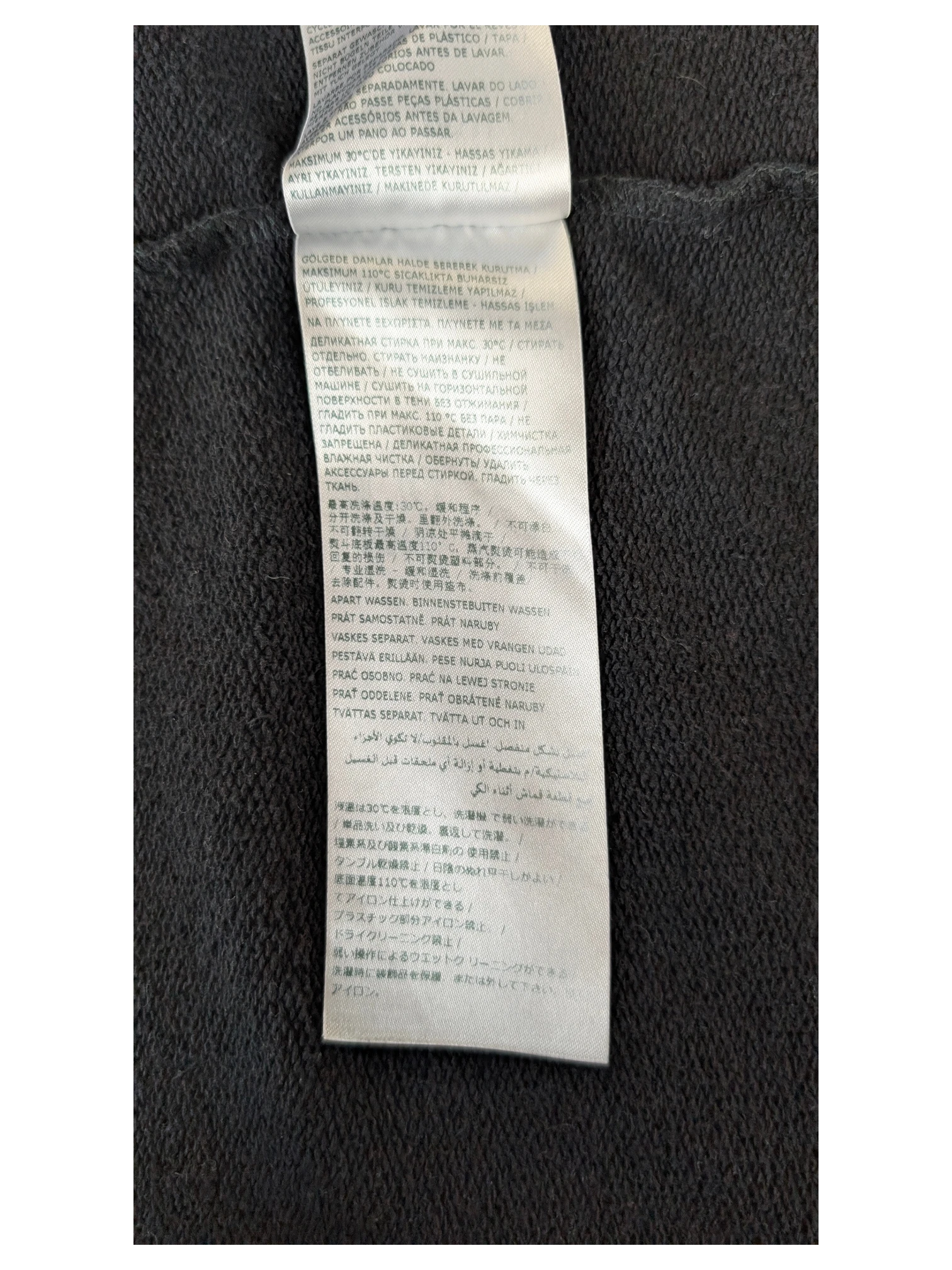 JAKE & IPI IBE MM6 Lunar New Year garment care label with multi-language washing instructions