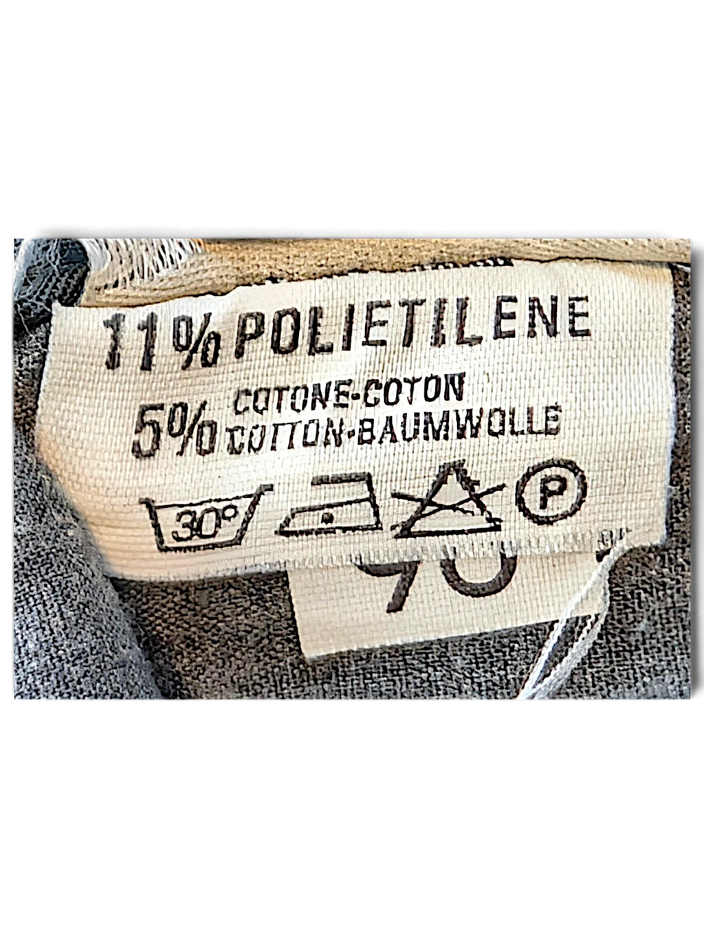 JAKE & IPI dark green cargo pants fabric care label showing material composition and washing instructions