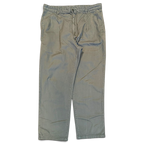 JAKE & IPI Carhartt Salford -työhousut, haalistunutta vihreää puuvillaa, suora lahje ja käytetty pinta.
