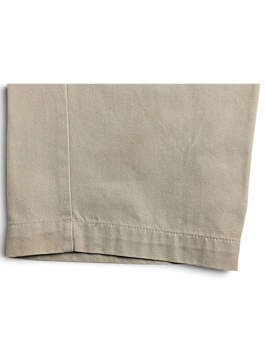 Close-up of the beige cotton fabric and hem detail on JAKE & IPI Cedarwood State straight leg chinos.