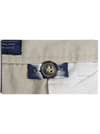 JAKE & IPI Cedarwood State beige cotton trousers detail showing the button and fabric composition label