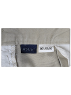 JAKE & IPI Cedarwood State beige trousers size label showing W34 L31 and internal garment details
