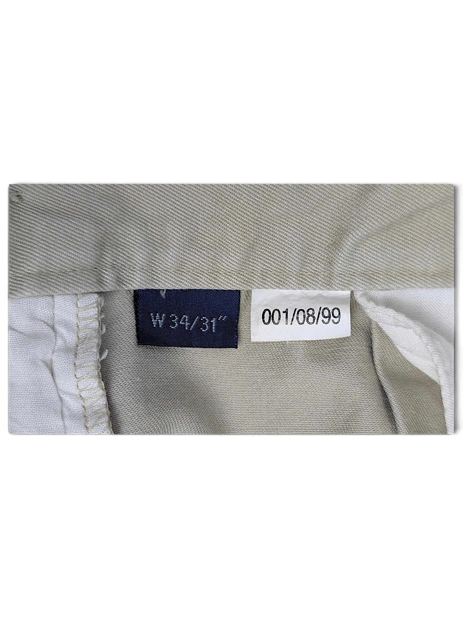 JAKE & IPI Cedarwood State beige trousers size label showing W34 L31 and internal garment details