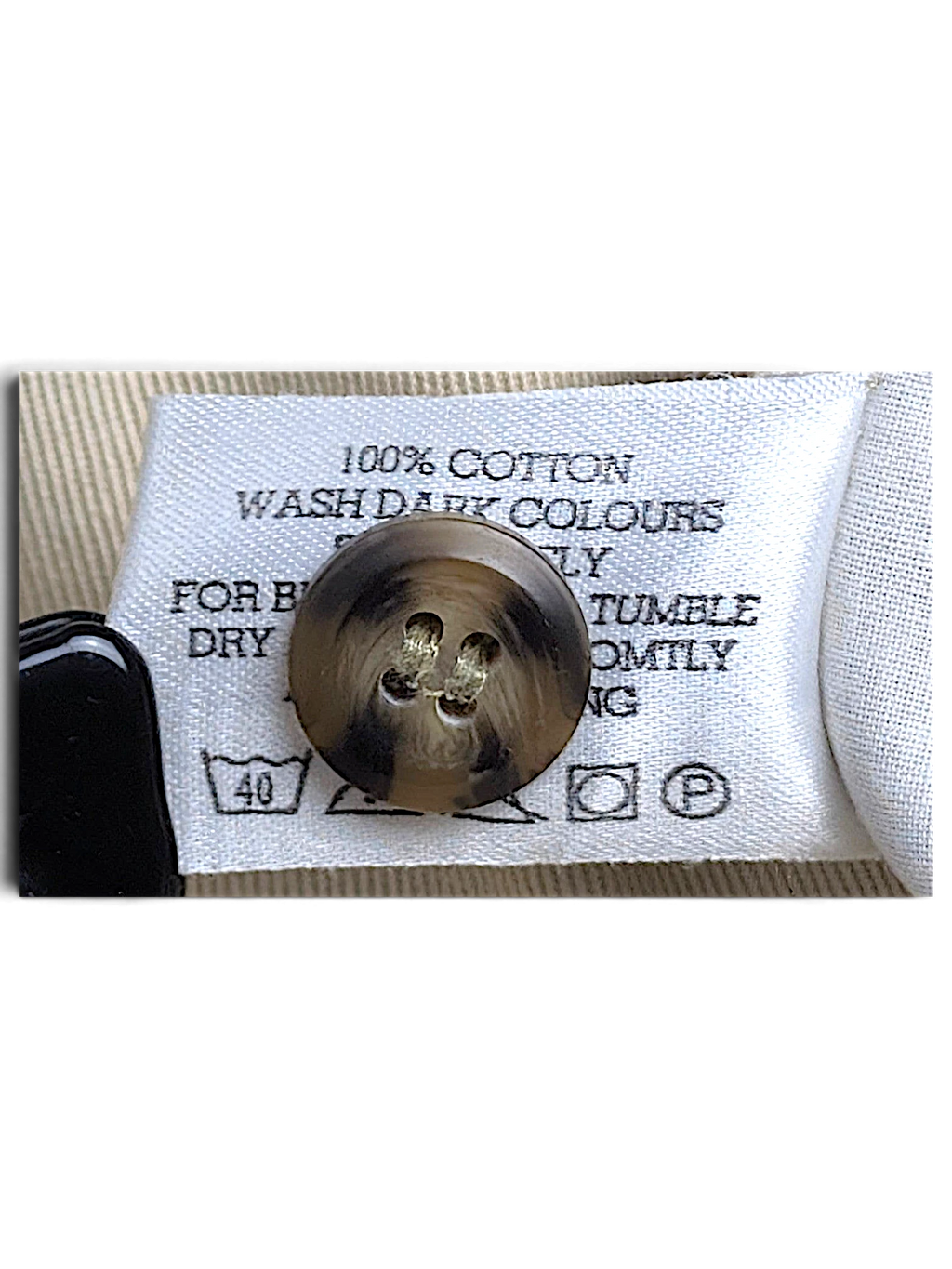 JAKE & IPI Cedarwood State beige chino spare button and 100% cotton care label detail