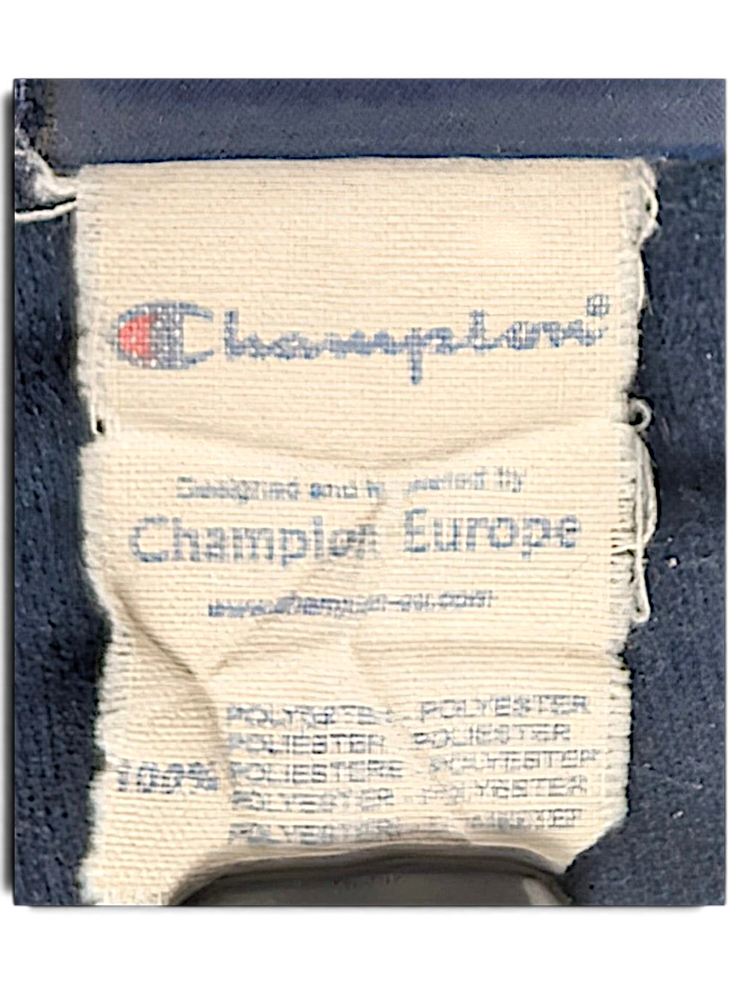 JAKE & IPI Champion Europe track pants care label showing polyester composition and branding