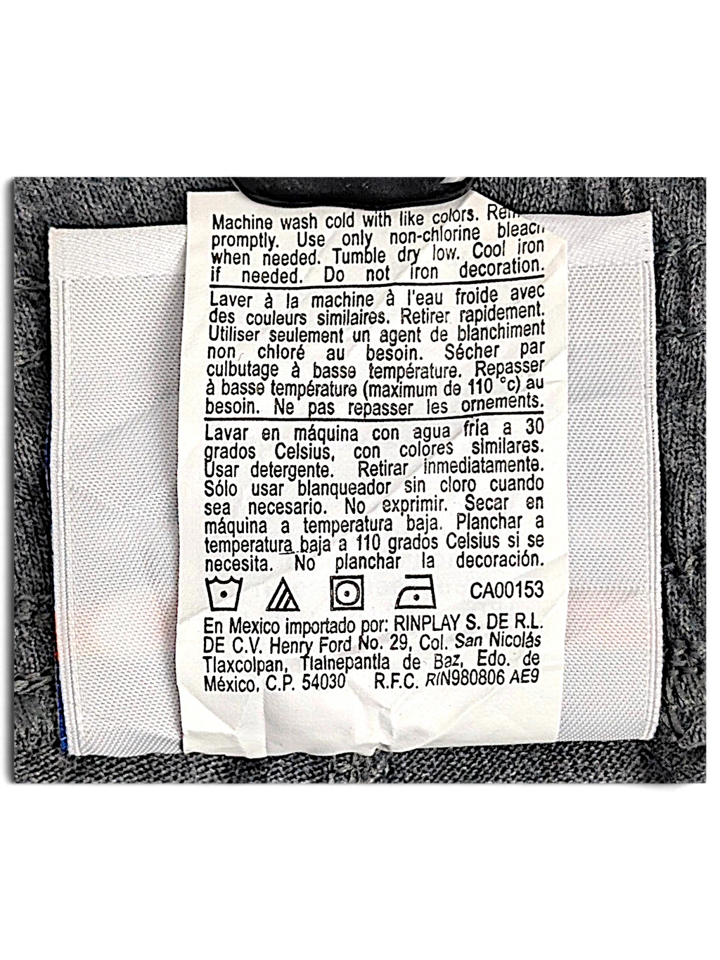 JAKE & IPI Champion fleece joggers care label with washing instructions in English, French, and Spanish.