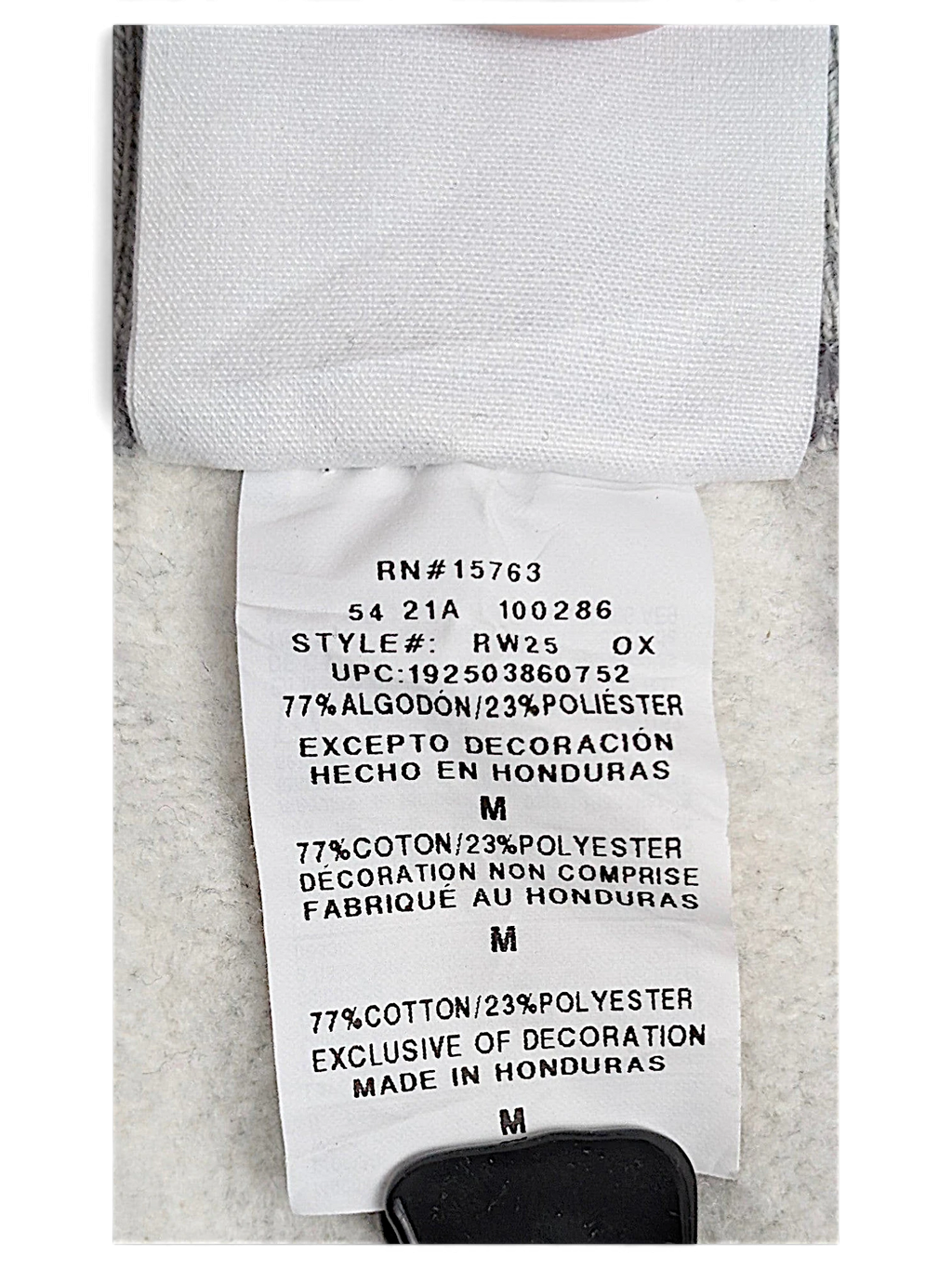 JAKE & IPI Champion Reverse Weave joggers care label showing size M and cotton polyester fabric composition