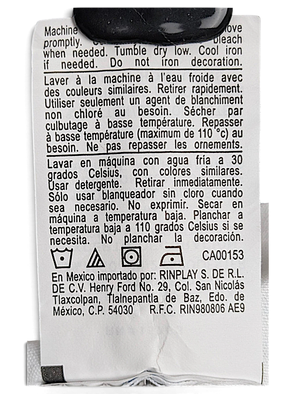 JAKE & IPI Champion Reverse Weave joggers care label with washing instructions in English, French, and Spanish.