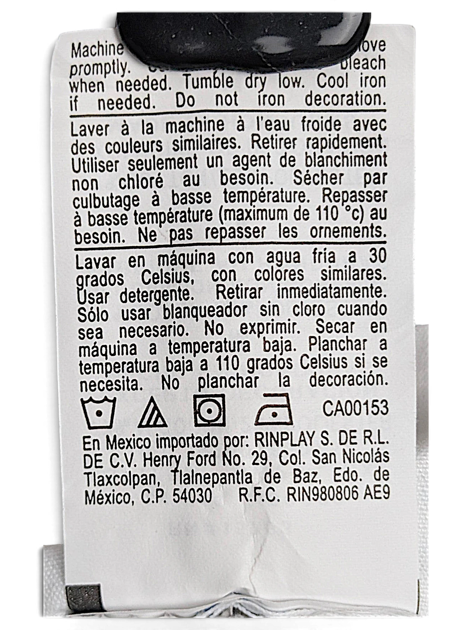 JAKE & IPI Champion Reverse Weave joggers care label with washing instructions in English, French, and Spanish.