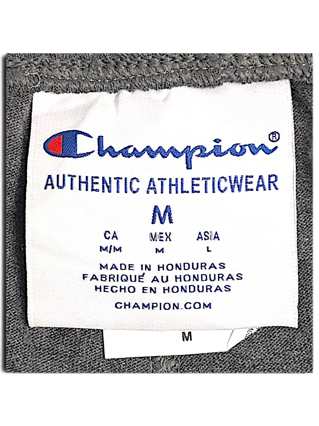 JAKE & IPI Champion fleece joggers size M clothing label showing brand logo and manufacturing details