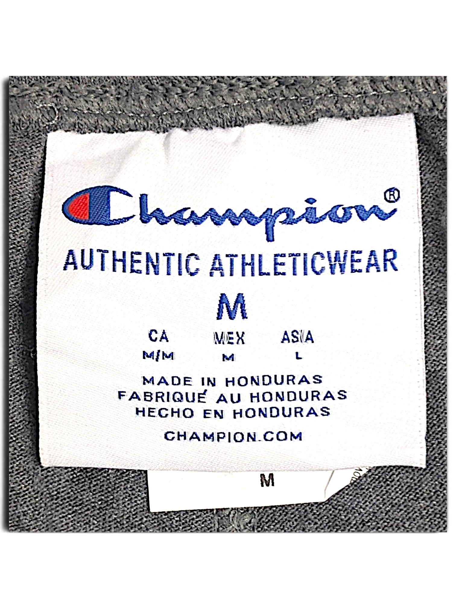 JAKE & IPI Champion fleece joggers size M clothing label showing brand logo and manufacturing details