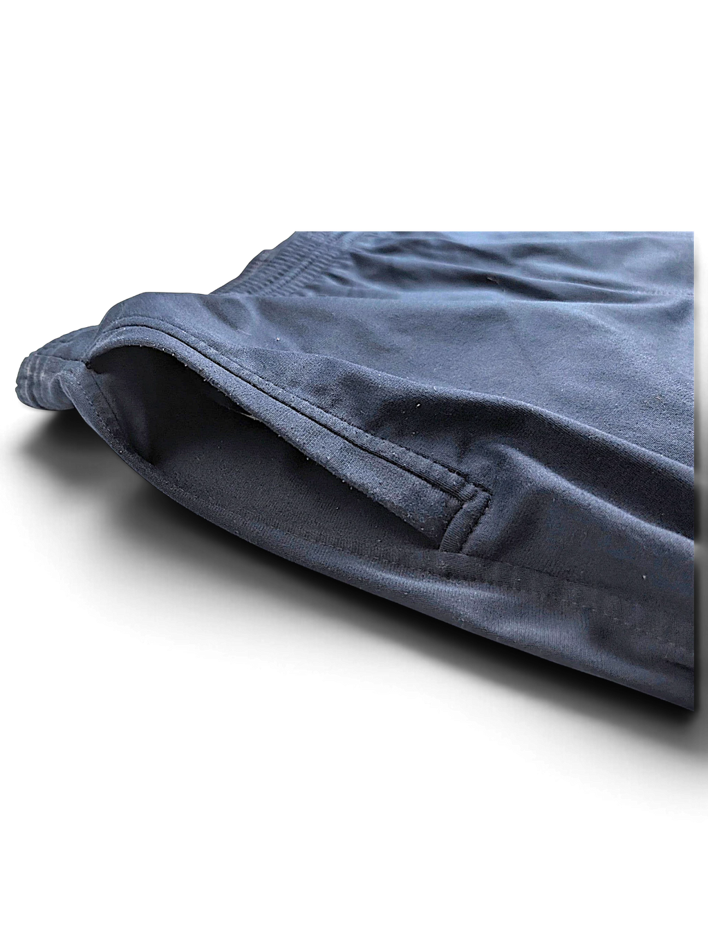 Close-up of the side pocket on JAKE & IPI pre-owned Champion navy blue open-hem track pants