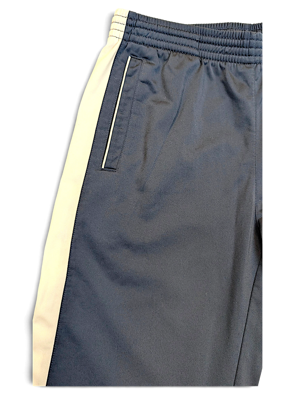 JAKE & IPI Champion navy track pants with white side stripes and zippered pocket detail
