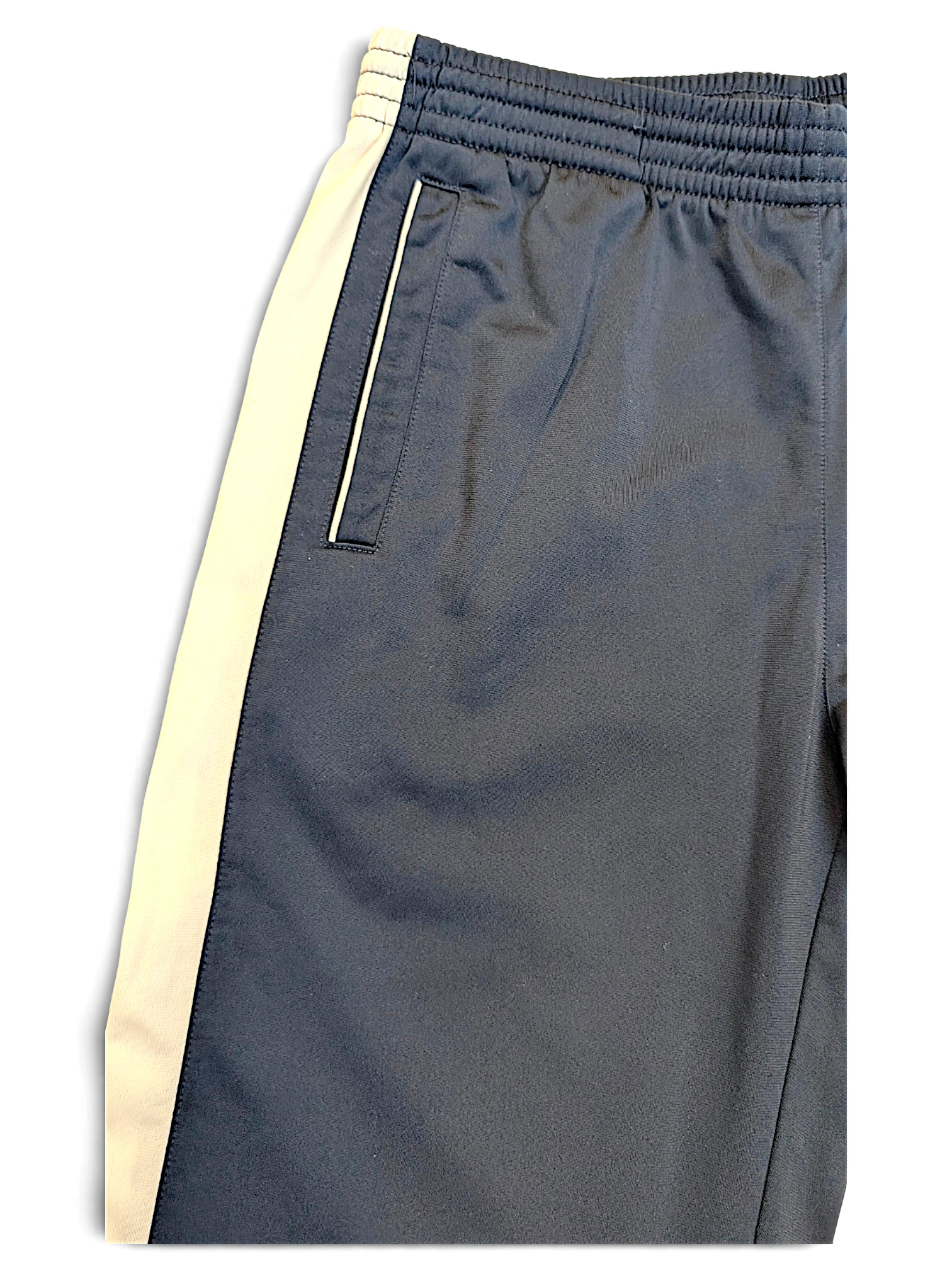 JAKE & IPI Champion navy track pants with white side stripes and zippered pocket detail