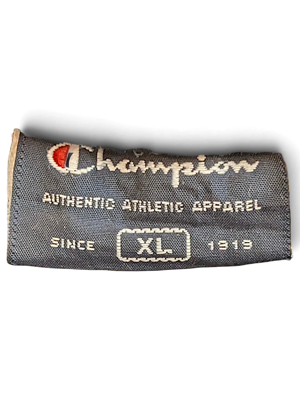 JAKE & IPI Champion brand clothing label in navy blue with white text and size XL indicator