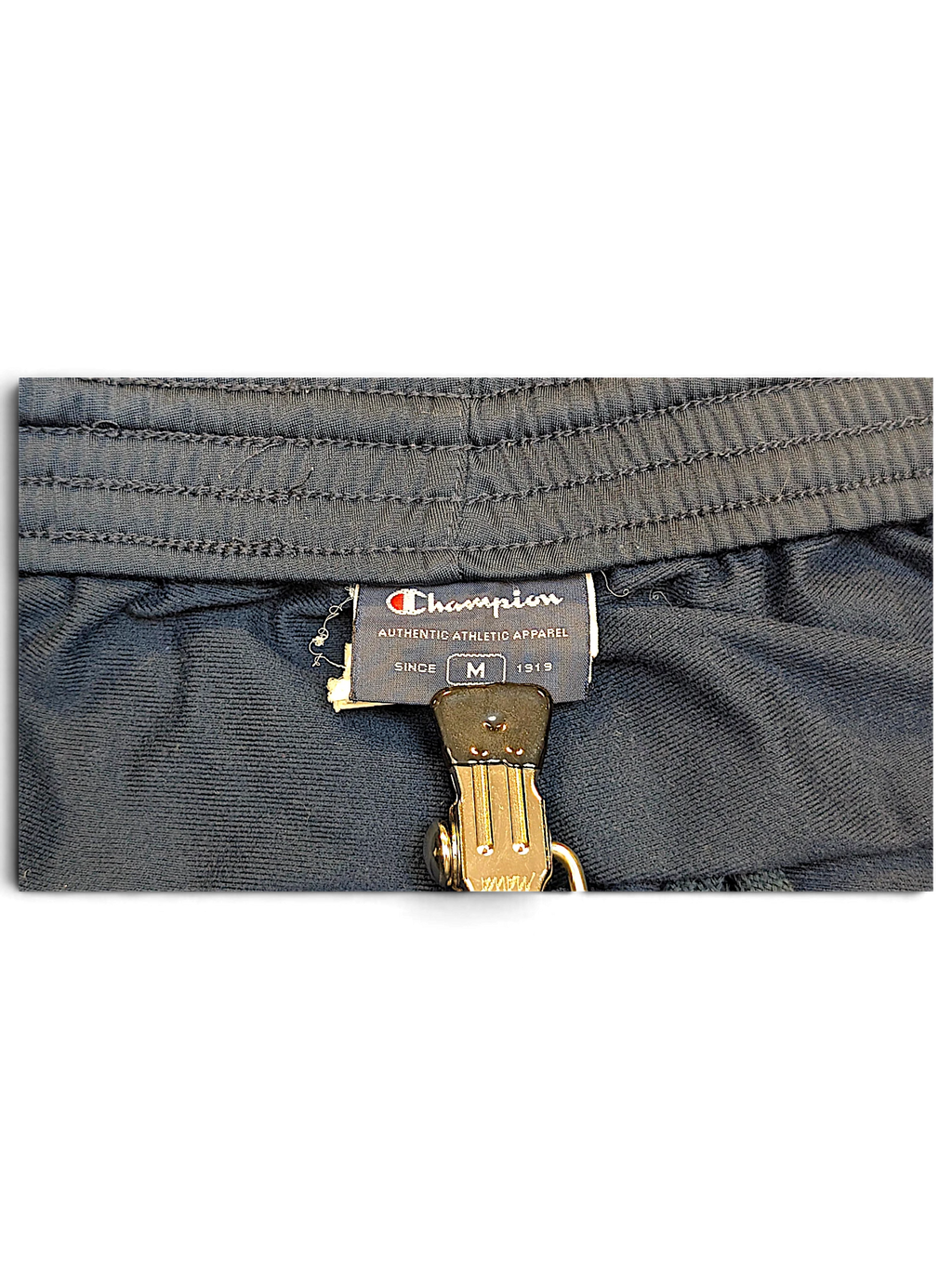 JAKE & IPI Champion navy track pants size M interior brand label and elastic waistband detail