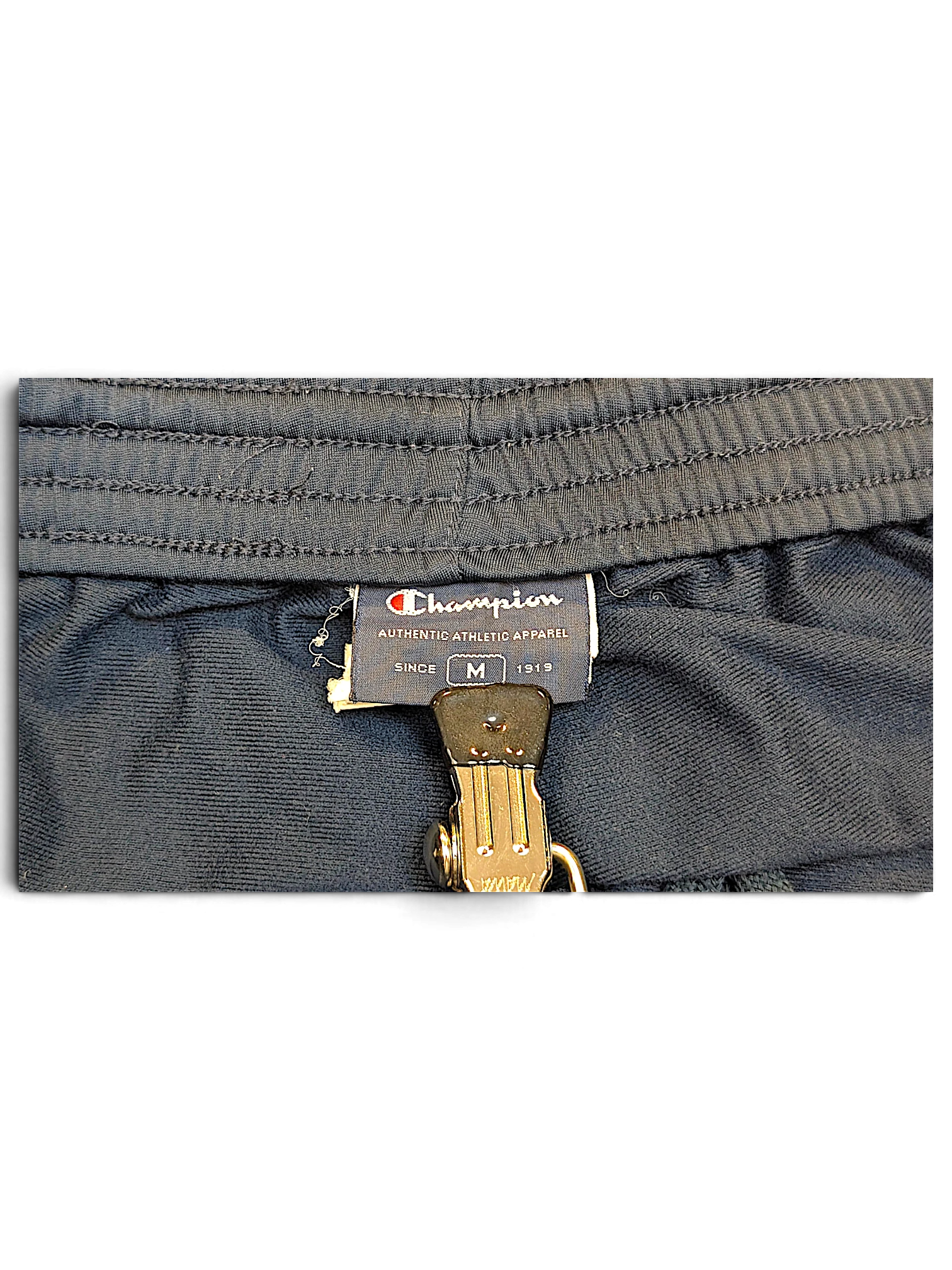 JAKE & IPI Champion navy track pants size M interior brand label and elastic waistband detail