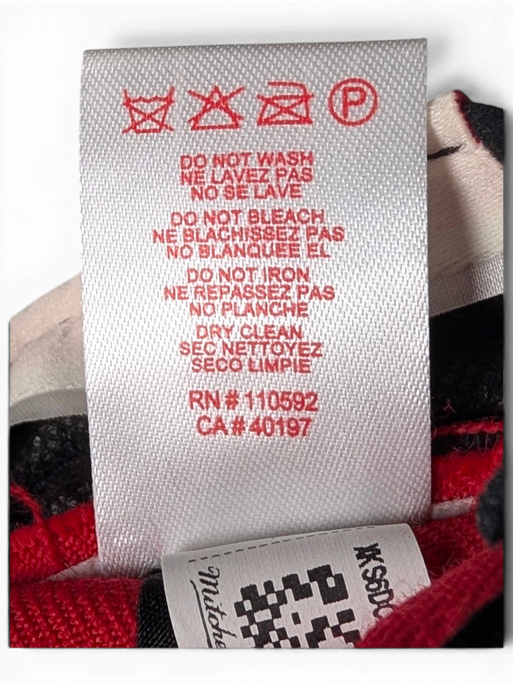 JAKE & IPI Chicago Bulls cap interior care label with red text and washing instructions on a white fabric tag