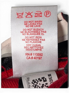 JAKE & IPI Chicago Bulls cap interior care label with red text and washing instructions on a white fabric tag