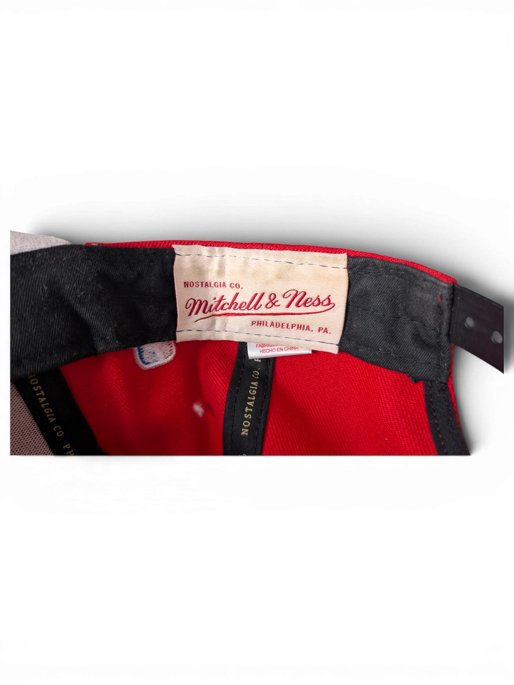 JAKE & IPI Chicago Bulls cap interior showing Mitchell & Ness branding and red fabric lining