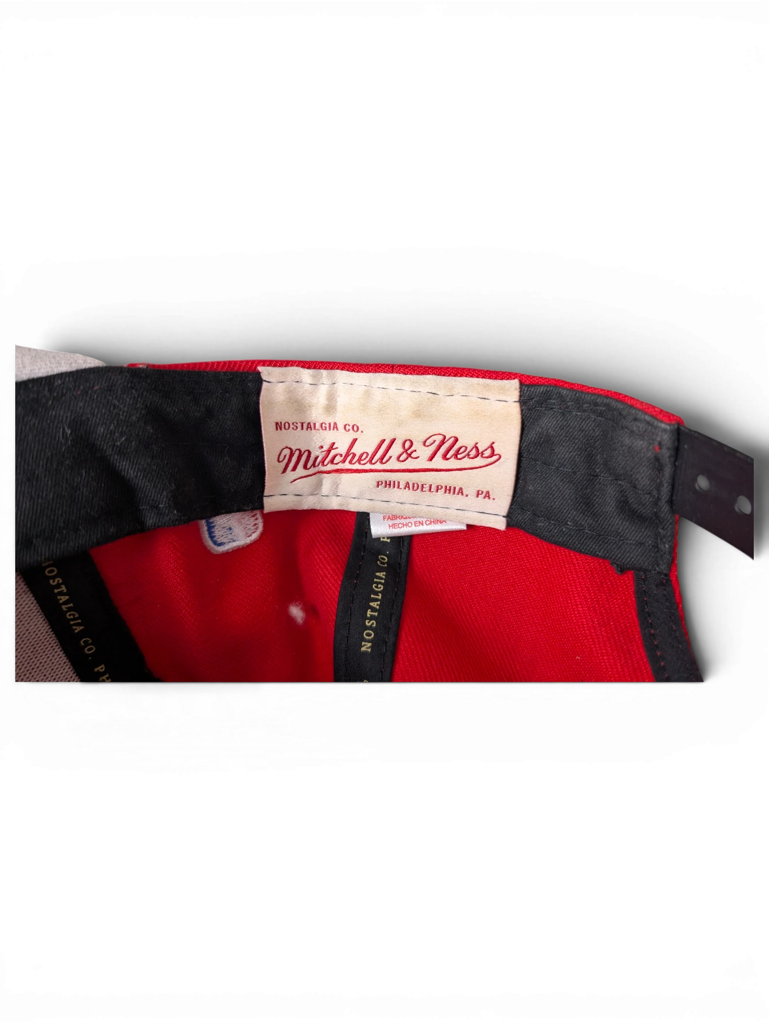 JAKE & IPI Chicago Bulls cap interior showing Mitchell & Ness branding and red fabric lining